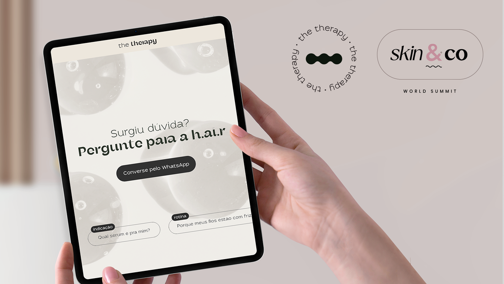 Tablet exibindo chatbot h.ai.r da The Therapy com botão WhatsApp, ao lado dos logos The Therapy e Skin&Co World Summit